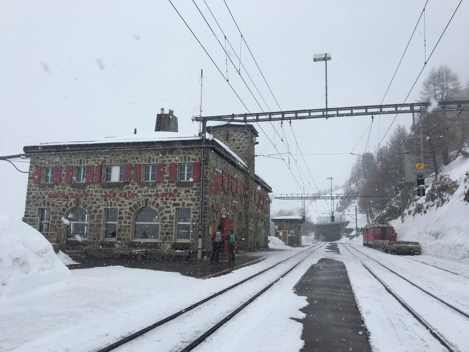 Alp Grüm station in winter, surrounded by snow at 2,091 metres on the Bernina Pass