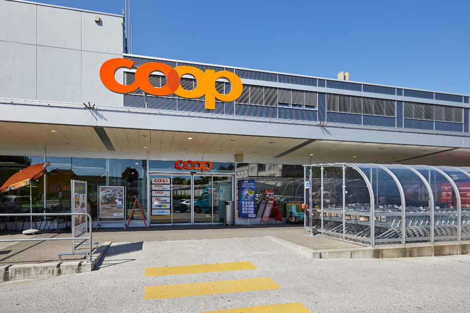 Coop supermarket exterior in Switzerland — the red Coop logo