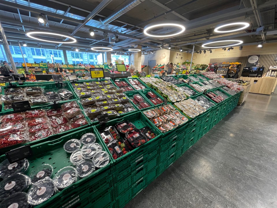 Inside a Coop supermarket in Switzerland — fresh produce and cheese counter