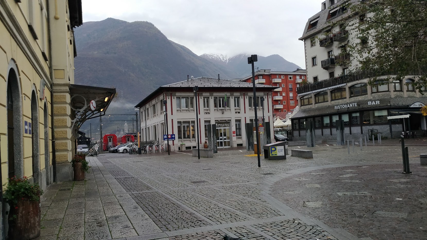 Tirano railway station with the Bernina Express and the Basilica di Madonna di Tirano