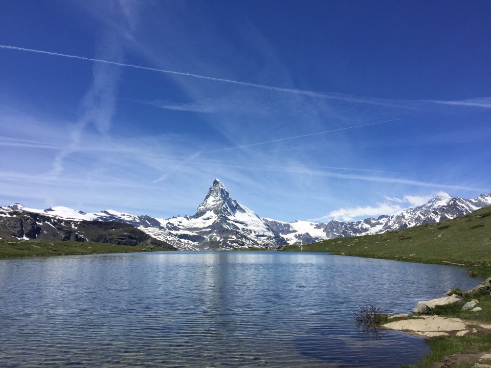 Stellisee lake reflecting the Matterhorn on the Five Lakes Walk, Zermatt