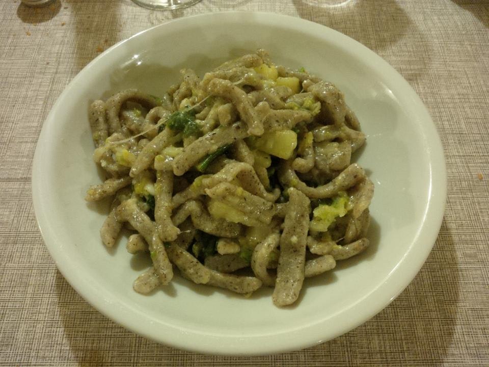 Traditional Valtellina food — pizzoccheri, bresaola, and sciatt